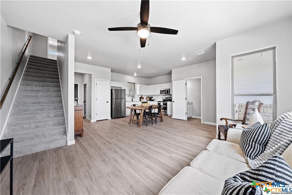 719 Meiomi Drive Temple, TX 76502 - Photo 12 of 32 a living room with furniture and wooden floor