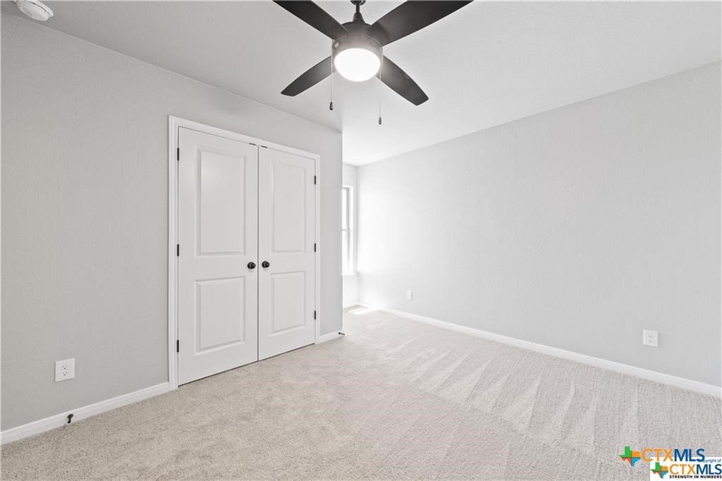 719 Meiomi Drive Temple, TX 76502 - Photo 25 of 32 an empty room with chandelier fan