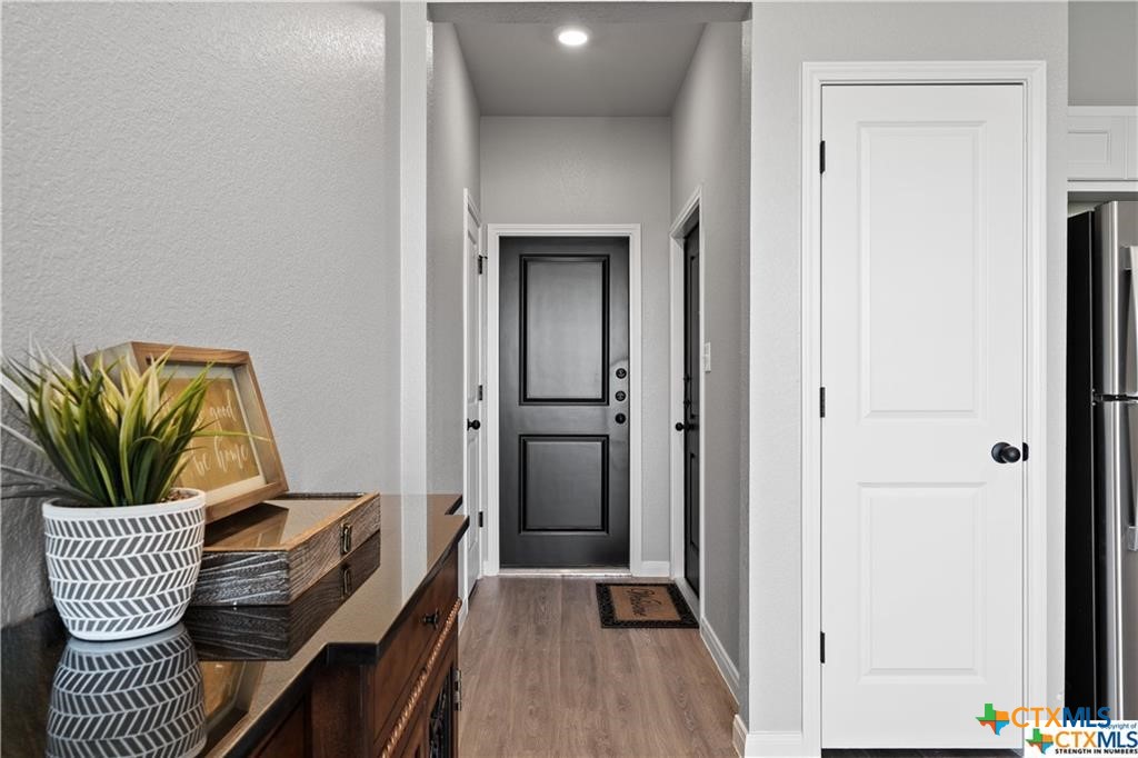 719 Meiomi Drive Temple, TX 76502 - Photo 3 of 32 a view of hallway with furniture and a potted plant