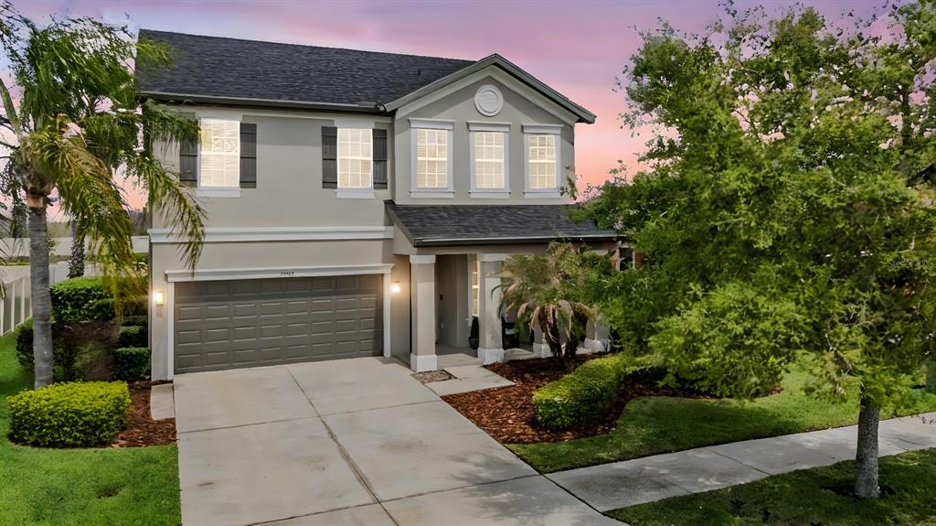 32383 Natural Bridge Road Wesley Chapel, FL 33543 - Photo 1 of 1 a front view of a house with garden