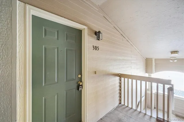 a view of a balcony from a hallway