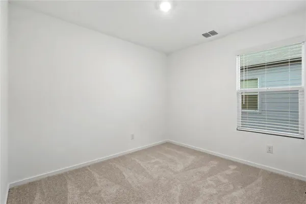 a view of empty room with windows