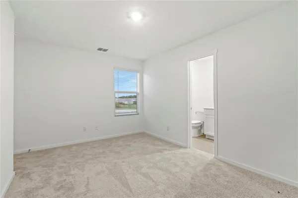 an empty room with a bathroom