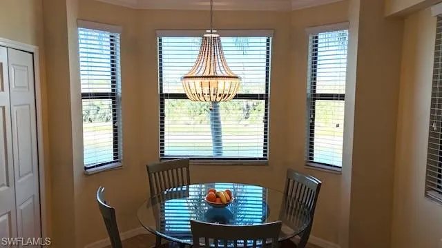 a view of a room with workspace and windows