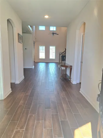 a view of gallery with wooden floor