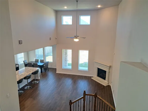 a view of a livingroom with furniture and a window