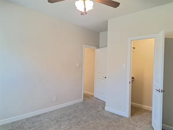 an empty room with a bathroom