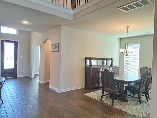 a view of a livingroom with furniture and wooden floor