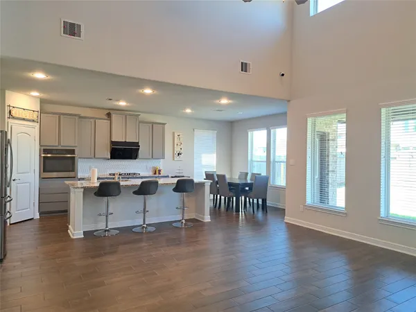 a view of a kitchen with dining table and chairs
