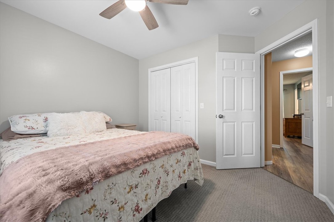 623 New Hope Road Anderson, SC 29626 - Photo 28 of 49 A comfortable bedroom features textured carpeting and classic white six-panel doors.