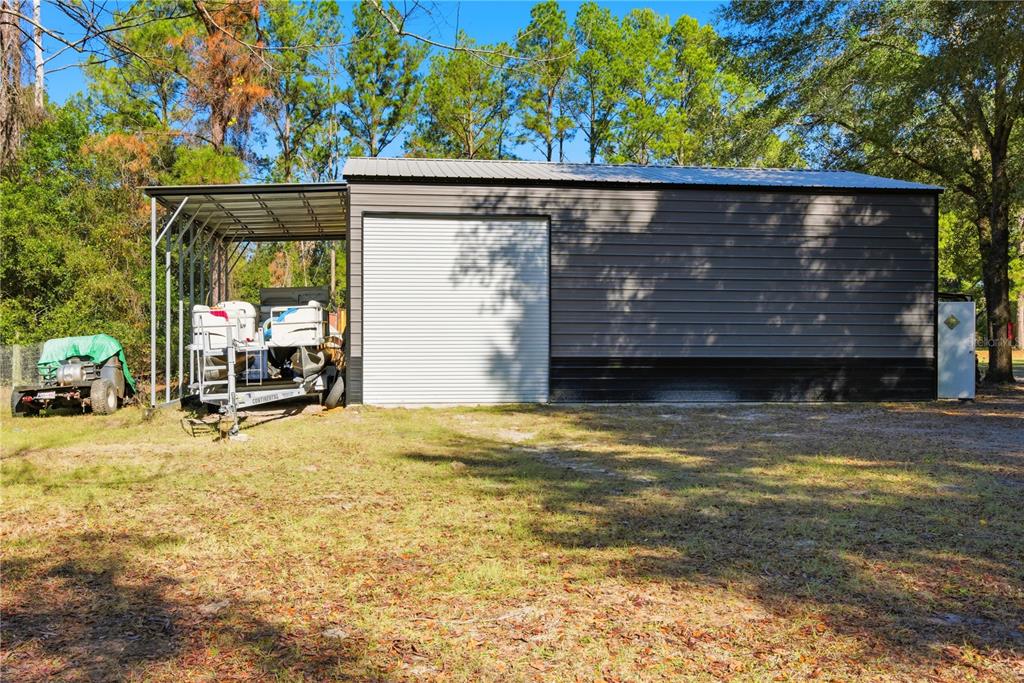 4506 Northwest 10th Street Bell, FL 32619 - Photo 14 of 50 a view of a house with wooden fence