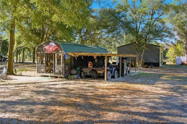 a view of a house with a backyard