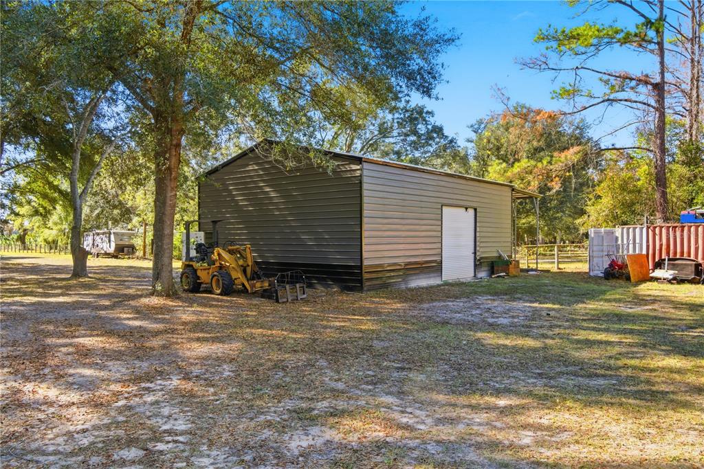 4506 Northwest 10th Street Bell, FL 32619 - Photo 20 of 50 a view of a house with a yard and tree