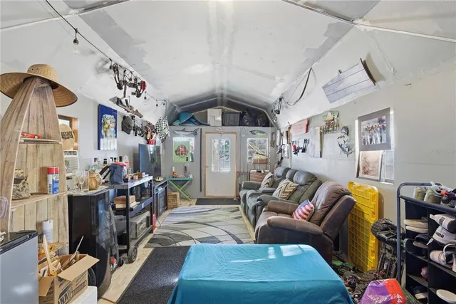 a store room with lots of furniture and clutter