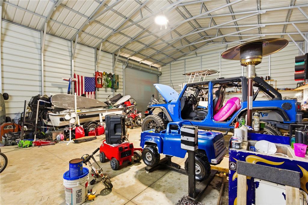 4506 Northwest 10th Street Bell, FL 32619 - Photo 26 of 50 a store room with lots of furniture and clutter