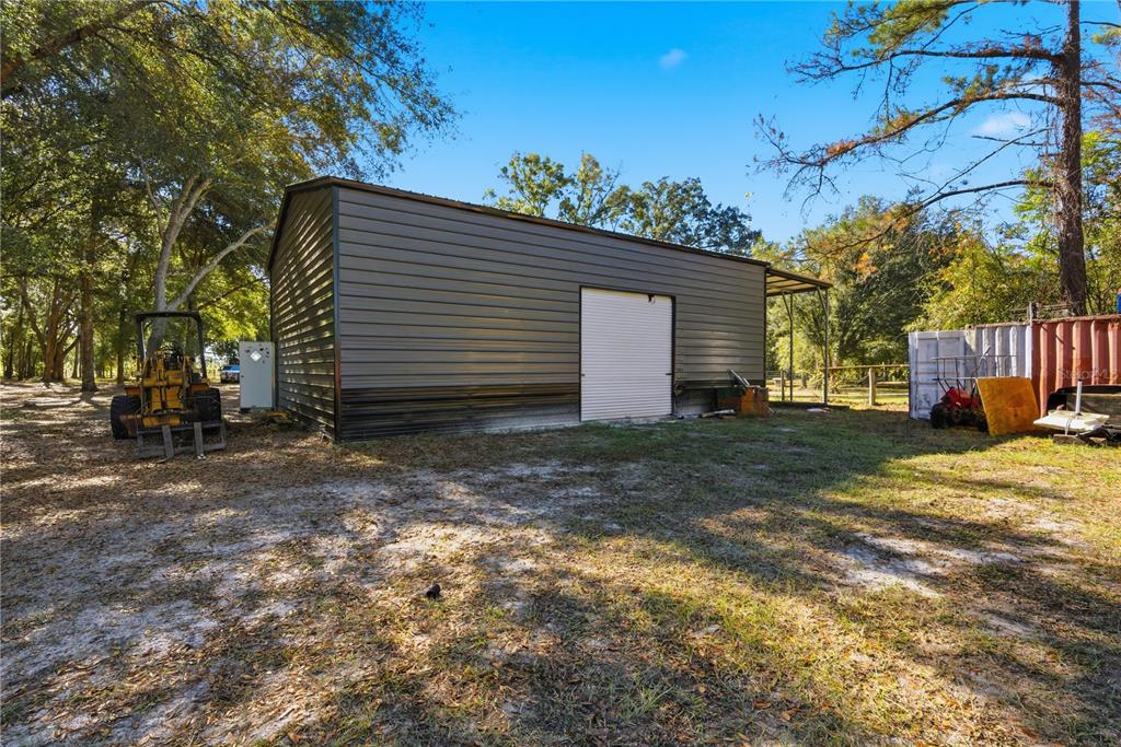 4506 Northwest 10th Street Bell, FL 32619 - Photo 28 of 50 a view of a house with a yard