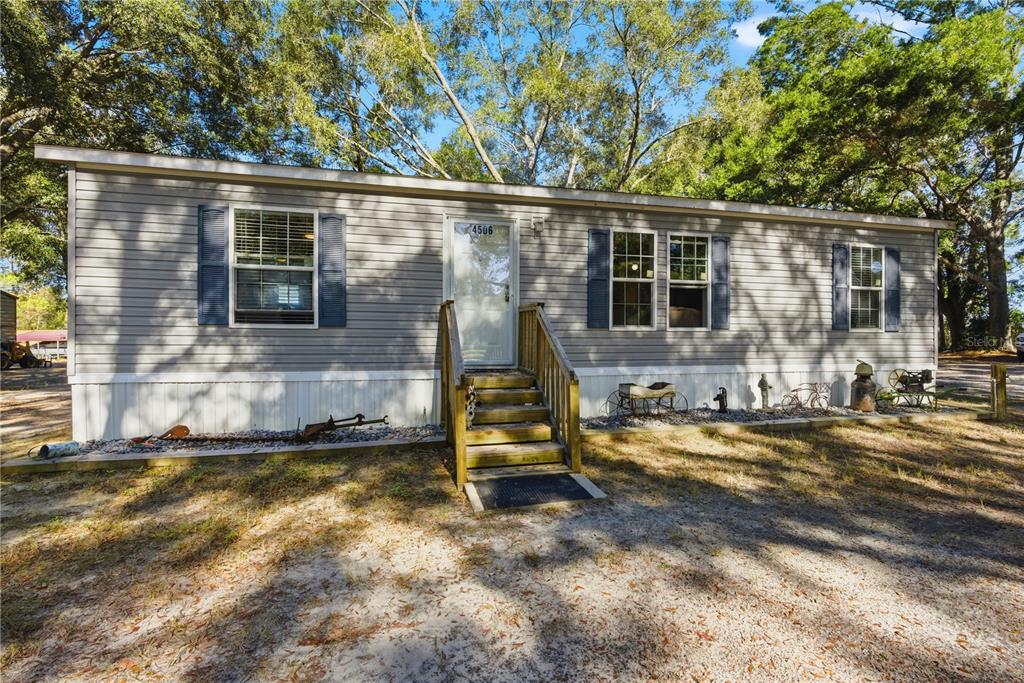 4506 Northwest 10th Street Bell, FL 32619 - Photo 29 of 50 front view of house with a yard