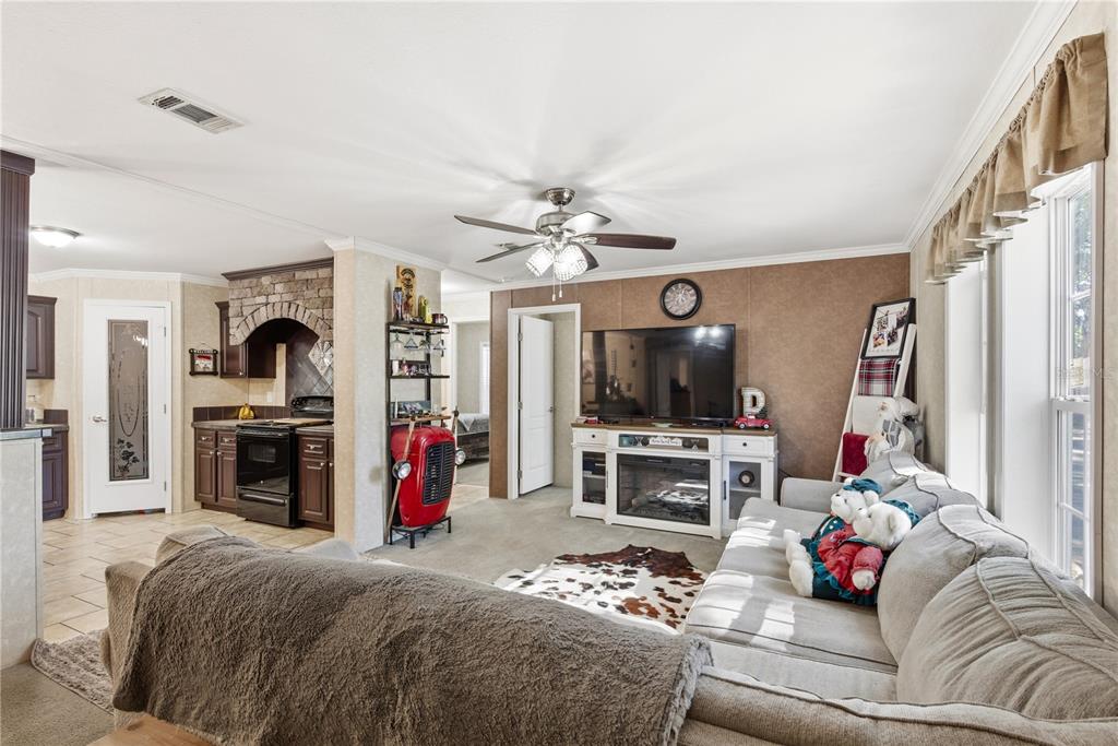 4506 Northwest 10th Street Bell, FL 32619 - Photo 30 of 50 a living room with furniture and a flat screen tv