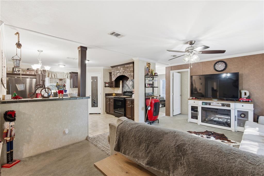 4506 Northwest 10th Street Bell, FL 32619 - Photo 31 of 50 a living room with furniture and a flat screen tv