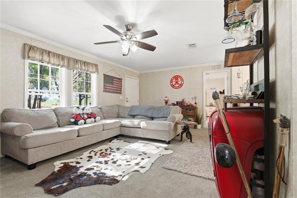 4506 Northwest 10th Street Bell, FL 32619 - Photo 33 of 50 a living room with furniture and a large window