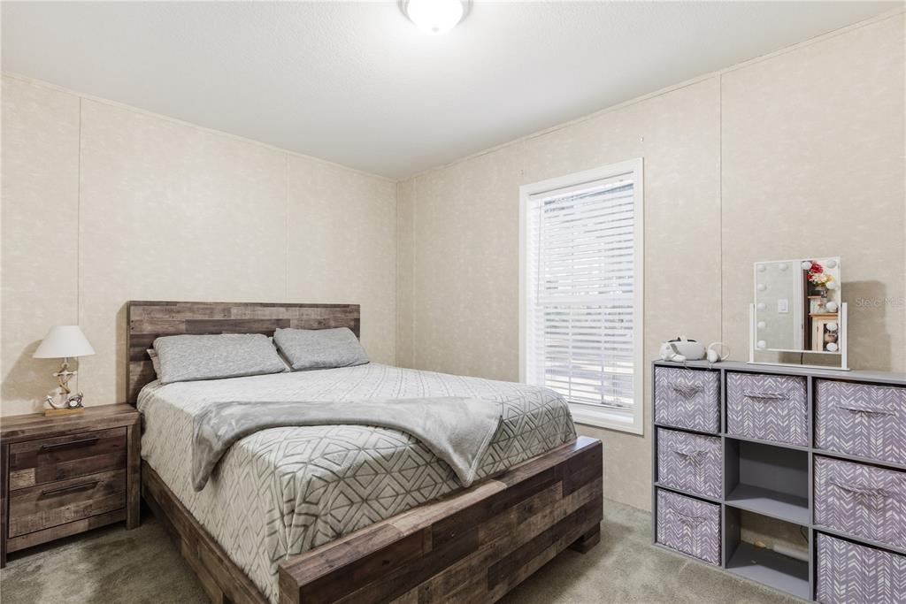 4506 Northwest 10th Street Bell, FL 32619 - Photo 35 of 50 a bedroom with a bed and window