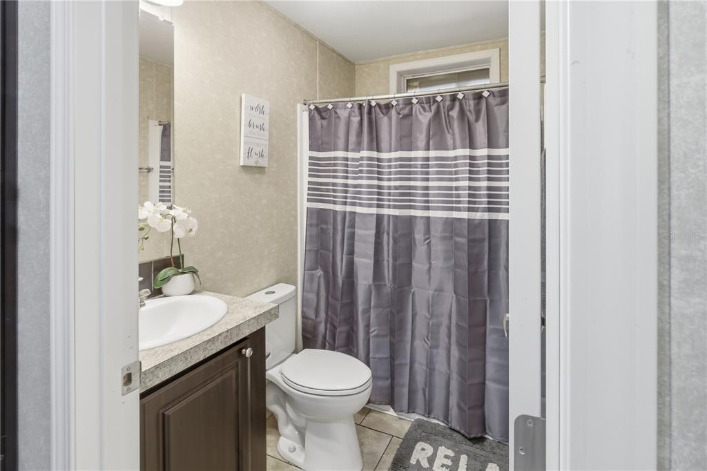 4506 Northwest 10th Street Bell, FL 32619 - Photo 36 of 50 a bathroom with a sink a toilet and shower