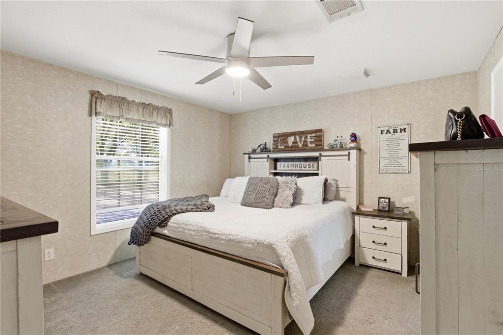 4506 Northwest 10th Street Bell, FL 32619 - Photo 42 of 50 a bedroom with a bed and a window