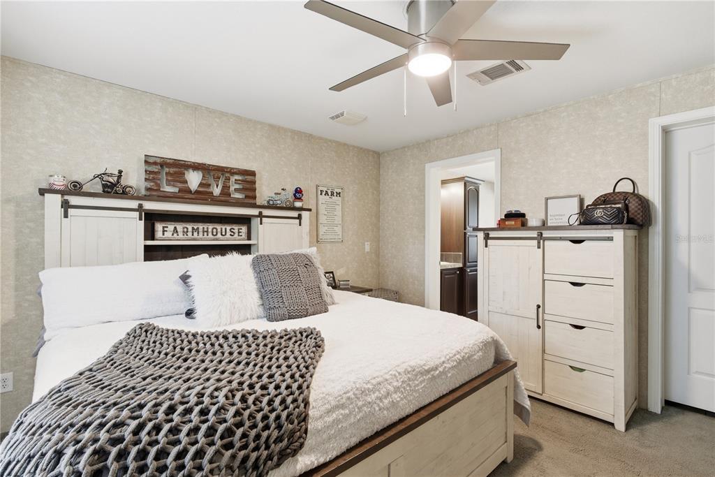 4506 Northwest 10th Street Bell, FL 32619 - Photo 43 of 50 a bedroom with a bed and a closet