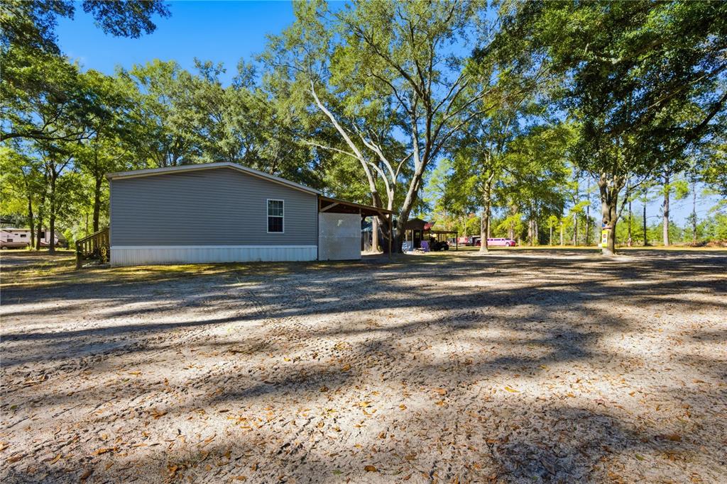 4506 Northwest 10th Street Bell, FL 32619 - Photo 50 of 50 a house view with a trees