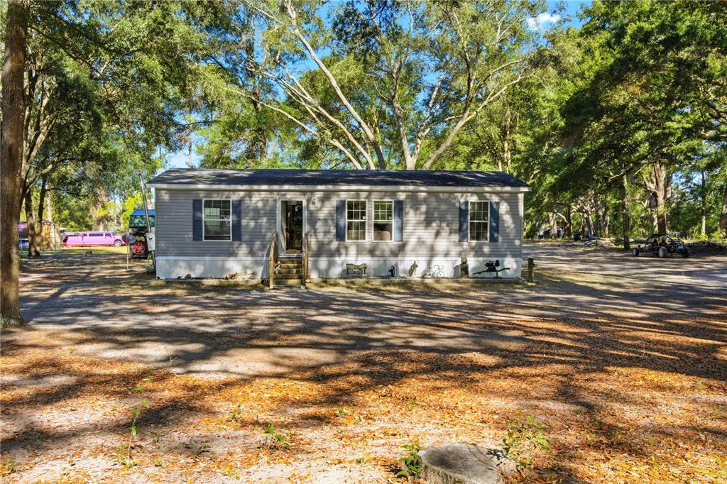 4506 Northwest 10th Street Bell, FL 32619 - Photo 7 of 50 a view of a house with a patio