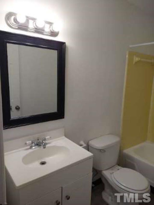 4240 Lake Ridge Drive, Unit 4240 Raleigh, NC 27604 - Photo 10 of 20 a bathroom with a toilet sink and mirror
