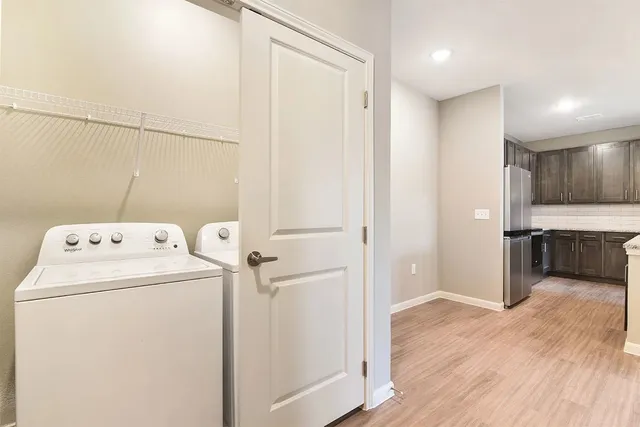 a view of a storage & utility room with washer and dryer