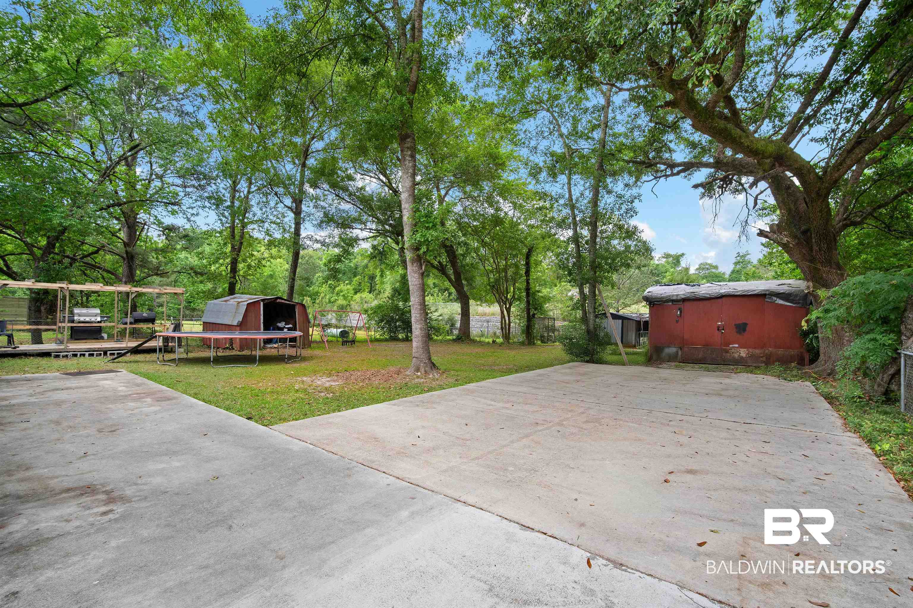 1451 West Morlee Drive Mobile, AL 36618 - Photo 28 of 30 View of patio featuring an outdoor structure, fence, and a storage shed