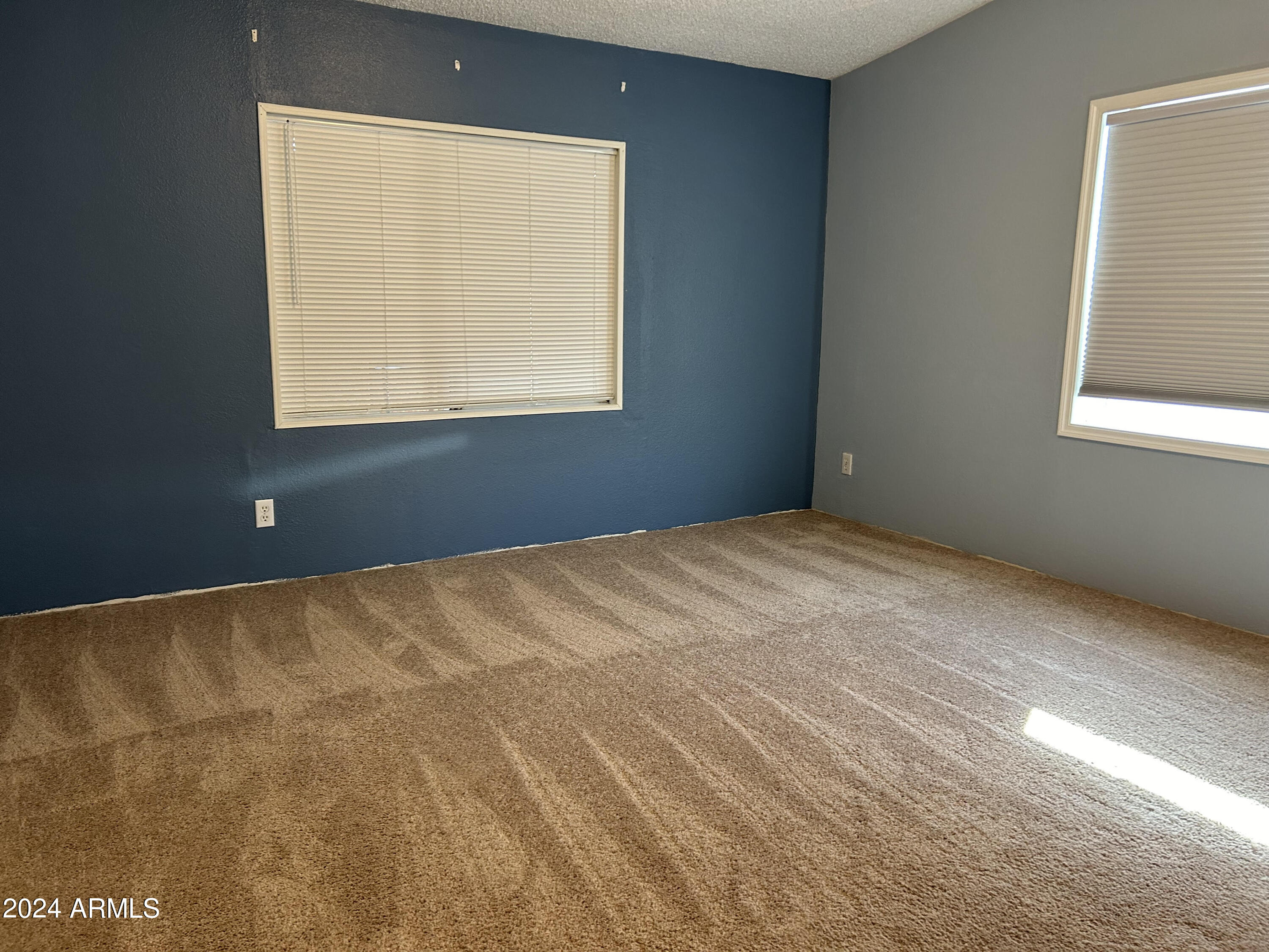 301 South Signal Butte Road, Unit 938 Apache Junction, AZ 85120 - Photo 6 of 11 a view of an empty room with a window