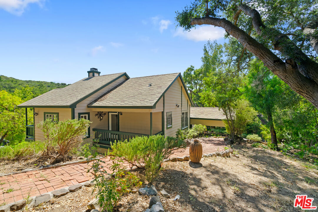 20912 Fontaine Road Topanga, CA 90290 - Photo 4 of 52 a view of a house with backyard and sitting area