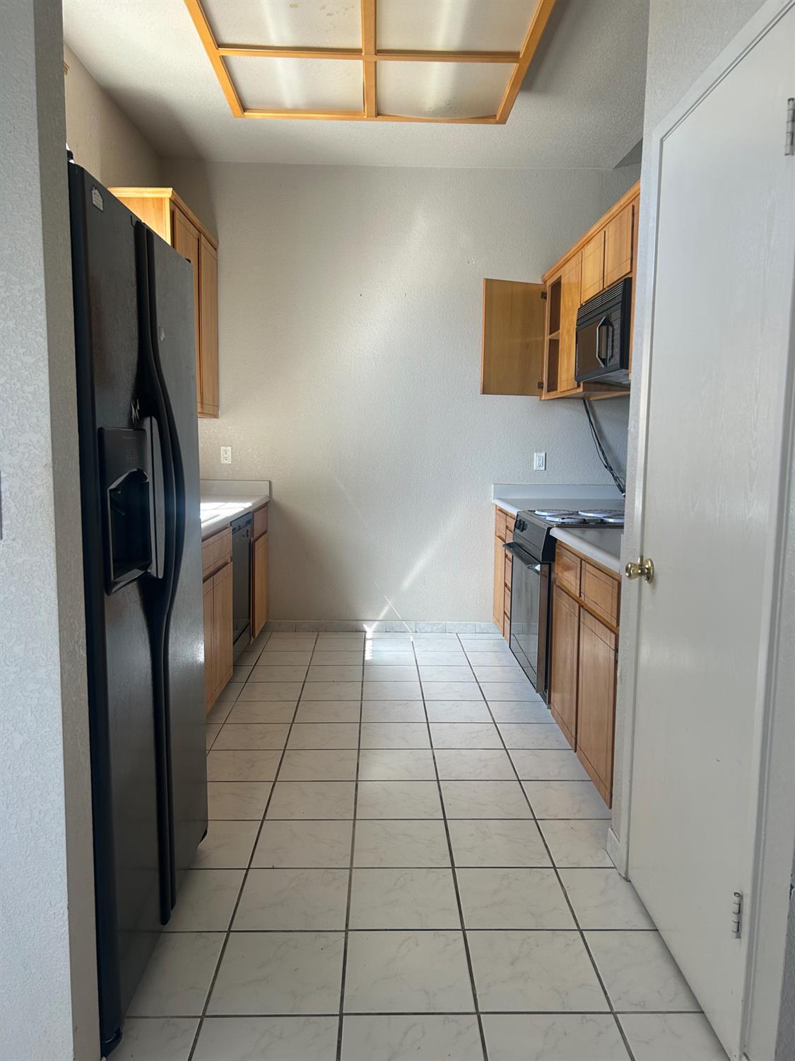 3421 Penny Lane Modesto, CA 95354 - Photo 2 of 12 a kitchen with stainless steel appliances granite countertop a refrigerator and a stove