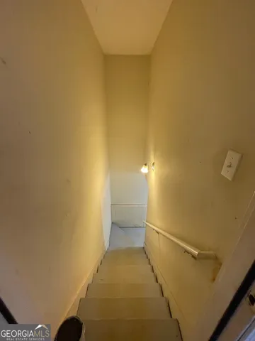 a view of a hallway with staircase