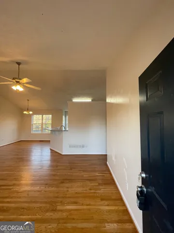 a view of a water heater room with a bathroom