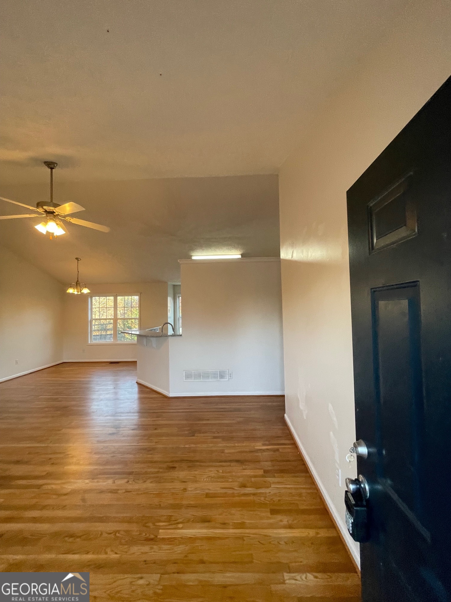 721 Meadow Spring Drive Temple, GA 30179 - Photo 6 of 43 a view of empty room with wooden floor