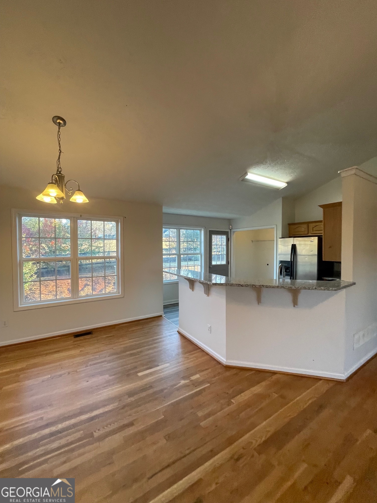 721 Meadow Spring Drive Temple, GA 30179 - Photo 9 of 43 a view of empty room with wooden floor and fan