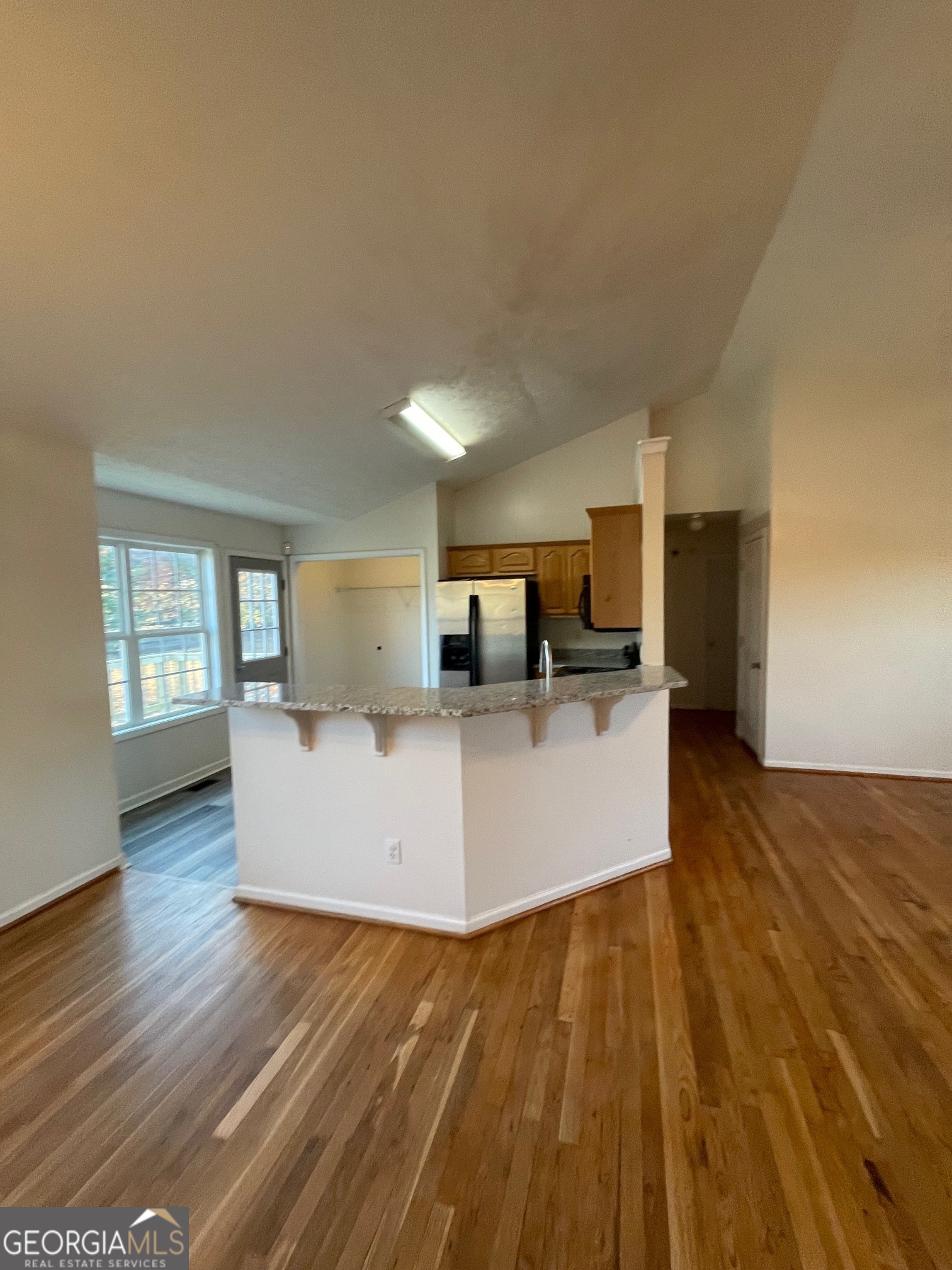 721 Meadow Spring Drive Temple, GA 30179 - Photo 10 of 43 a living room with furniture and a wooden floor