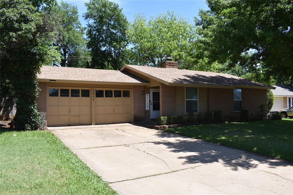 1301 Doncaster Street Irving, TX 75062 - Photo 18 of 19 a front view of a house with a garden