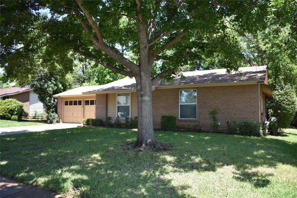 1301 Doncaster Street Irving, TX 75062 - Photo 19 of 19 a front view of house with yard and green space
