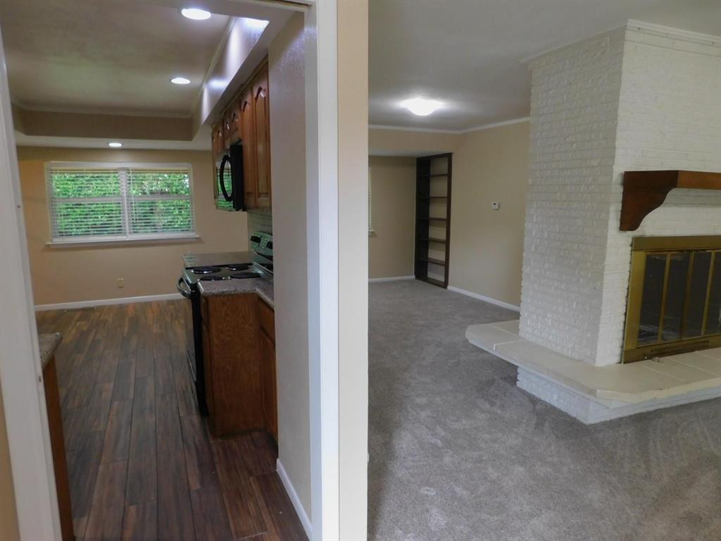 1301 Doncaster Street Irving, TX 75062 - Photo 2 of 19 a view of a hallway with wooden floor and a window