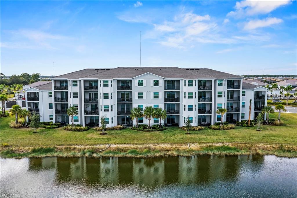 43993 Boardwalk Loop, Unit 1915 Babcock Ranch, FL 33982 - Photo 21 of 26 a view of a house with swimming pool and a yard