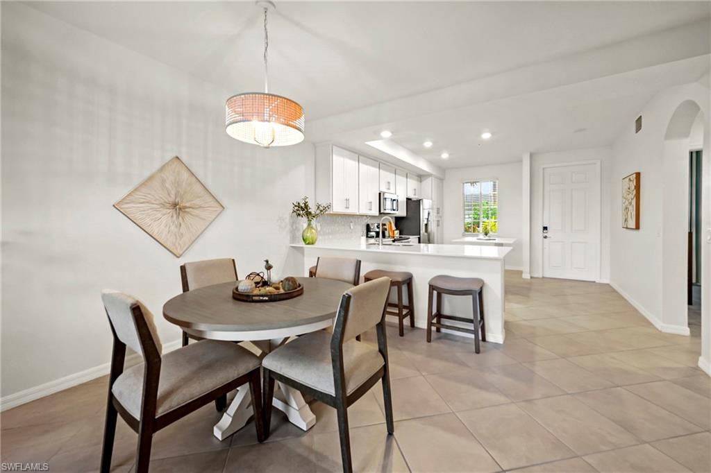 43993 Boardwalk Loop, Unit 1915 Babcock Ranch, FL 33982 - Photo 10 of 26 a dining room with furniture and window
