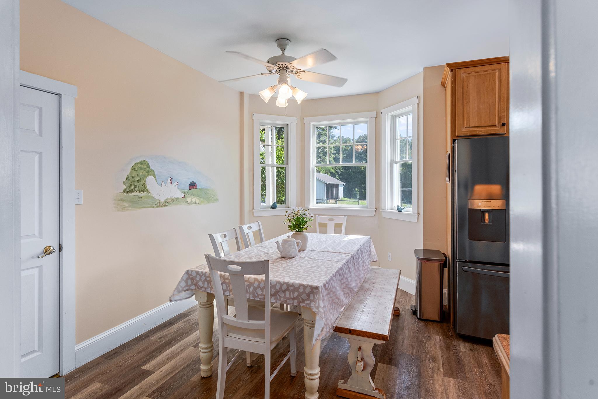 137 Elk Ranch Park Road Elkton, MD 21921 - Photo 12 of 52 a dining room with furniture a chandelier and wooden floor