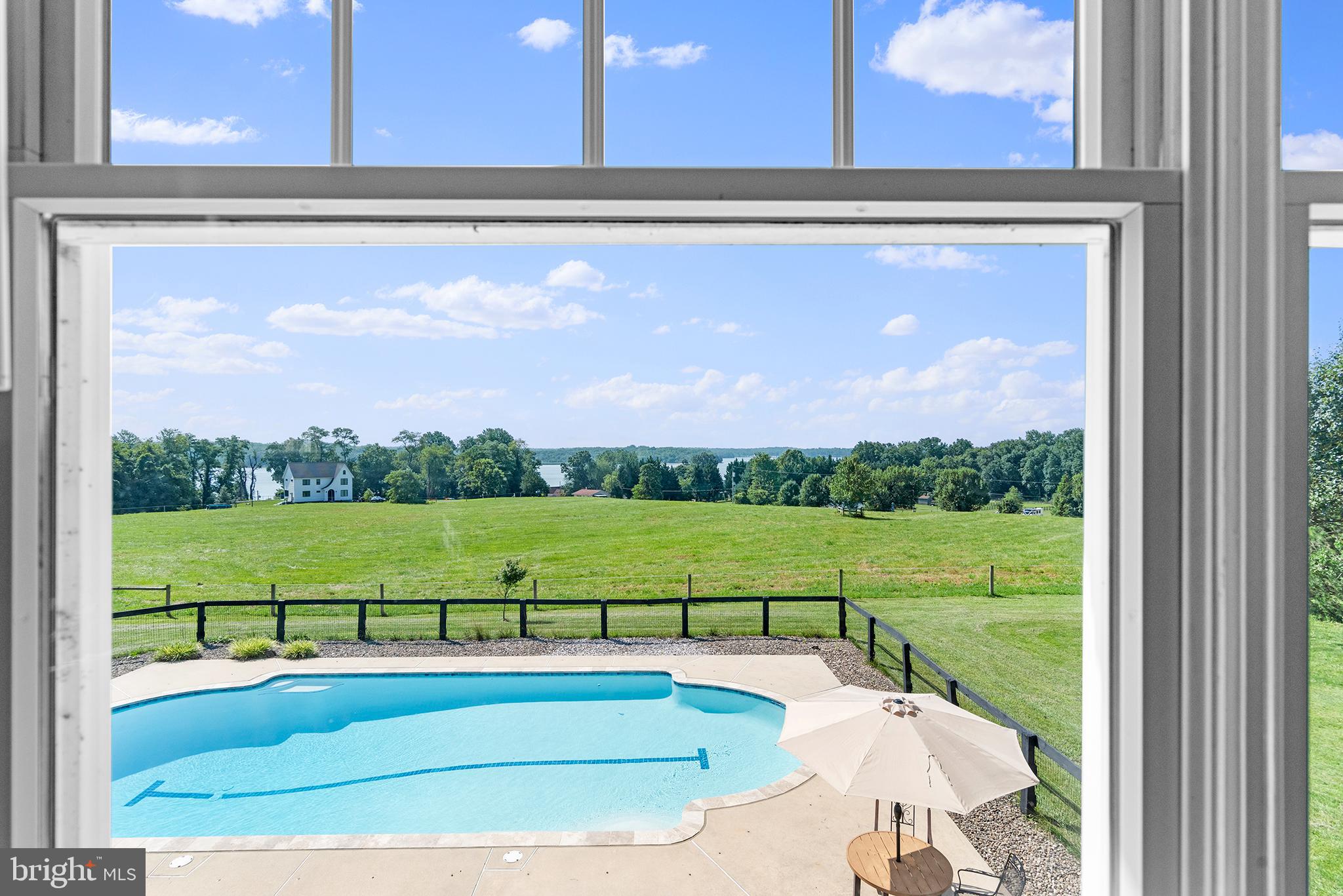 137 Elk Ranch Park Road Elkton, MD 21921 - Photo 21 of 52 a view of a pool with a yard from a window