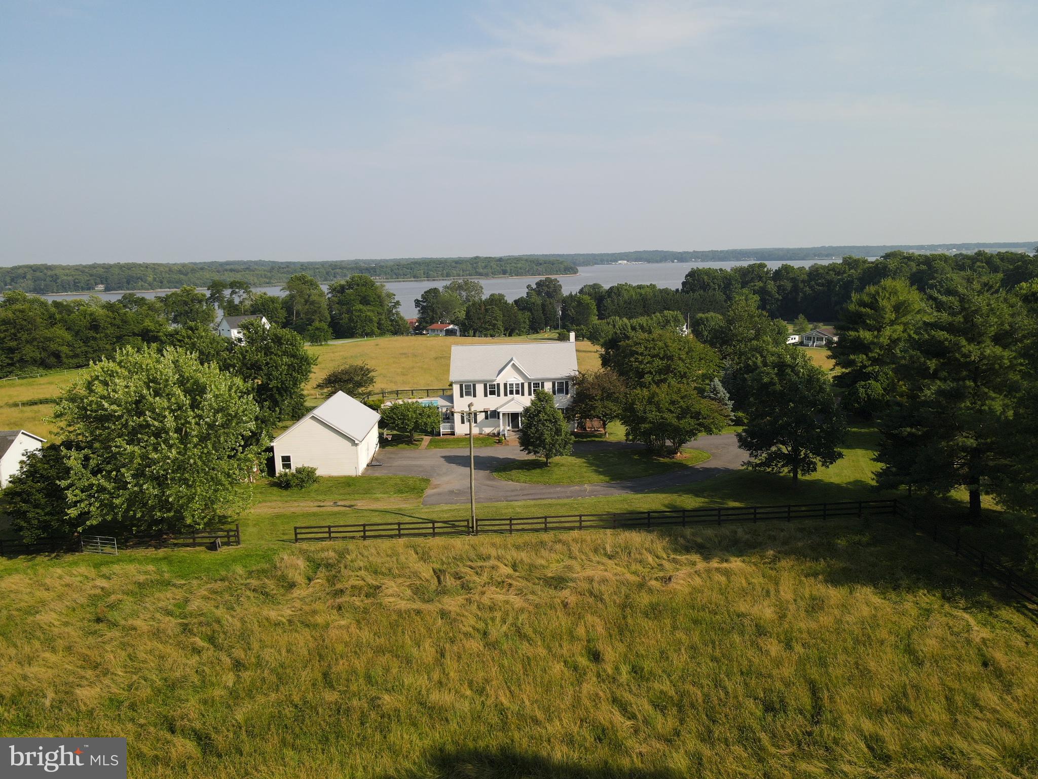 137 Elk Ranch Park Road Elkton, MD 21921 - Photo 35 of 52 a view of a lake with a house in the background
