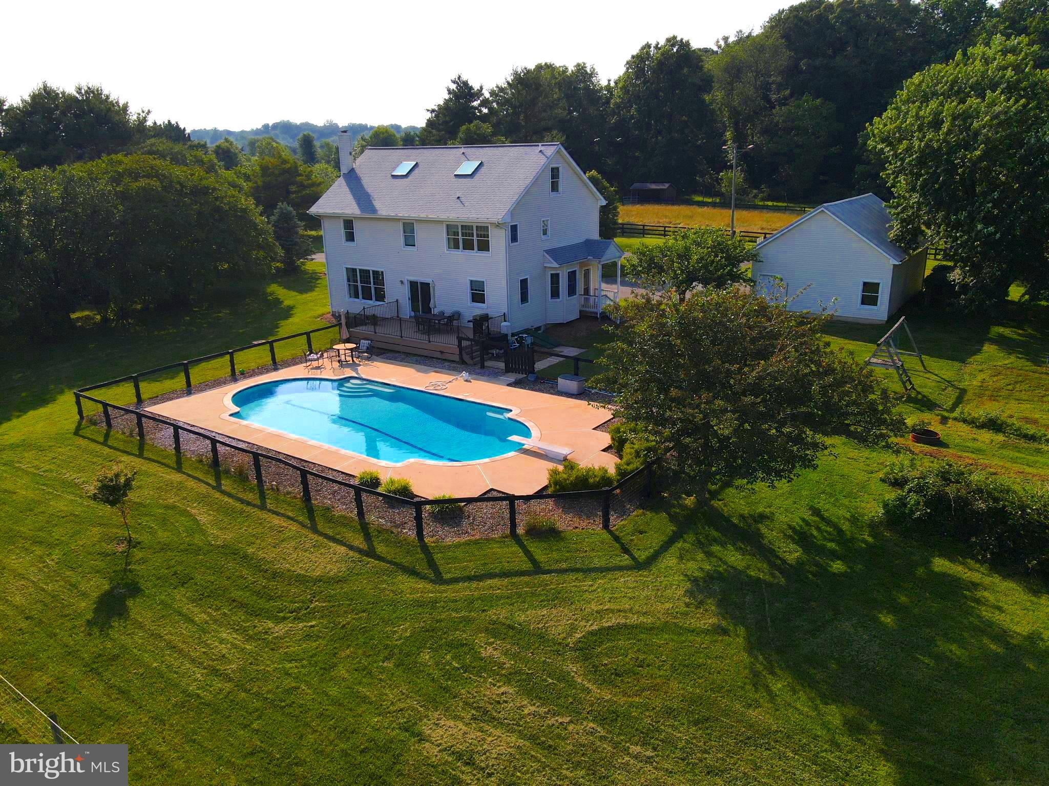 137 Elk Ranch Park Road Elkton, MD 21921 - Photo 36 of 52 a swimming pool with some plants and large trees
